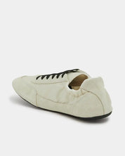 elastic back detail of suede sneakers in white