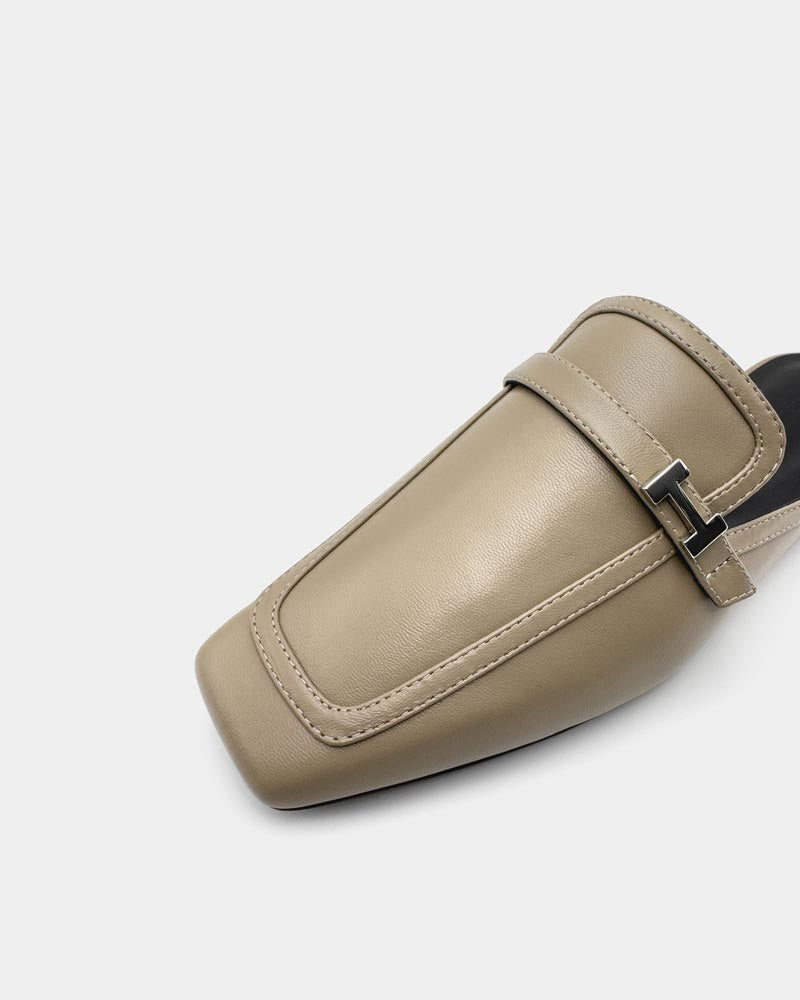 Beige leather mule shoes with a cushioned leather sole