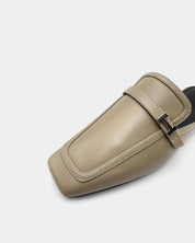 Beige leather mule shoes with a cushioned leather sole