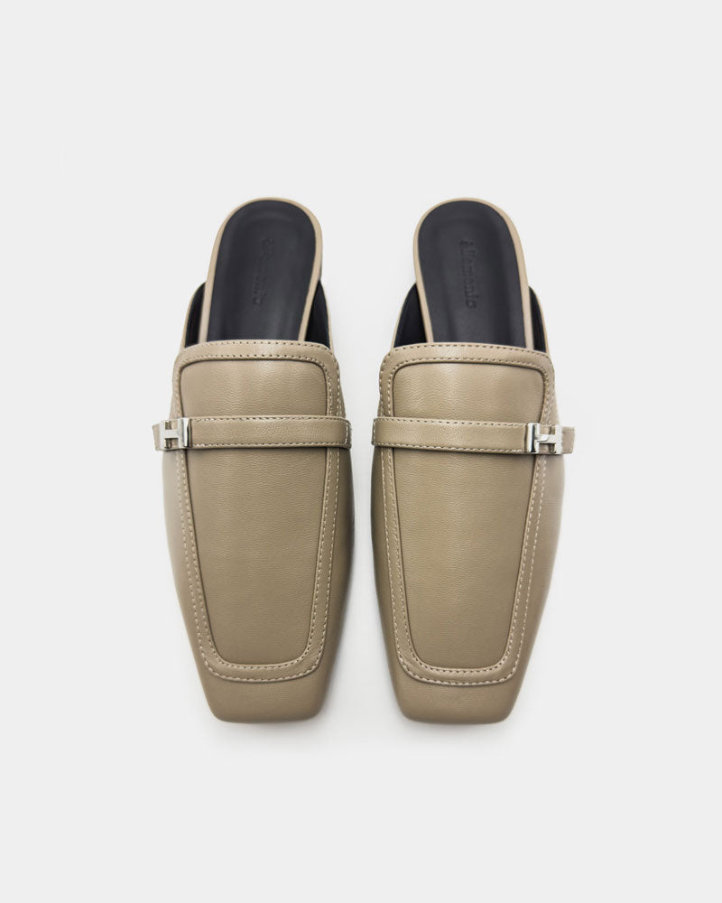 Pair of beige mules shoes with cushioned leather footbed
