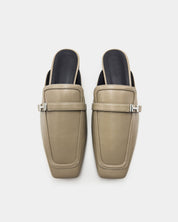 Pair of beige mules shoes with cushioned leather footbed