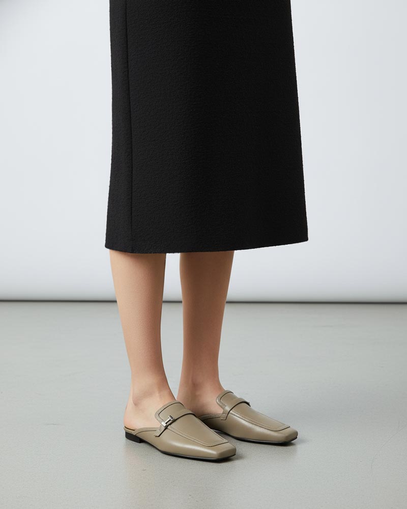 Woman wearing mules shoes in slip on style
