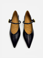 top view of black Mary Jane flats with gold buckle strap