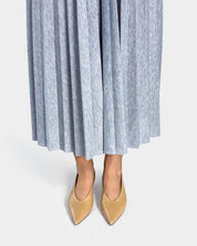 model wearing nude leather kitten heels with all day support