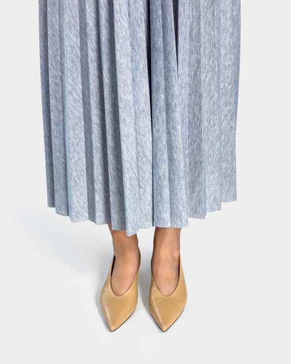 model wearing nude leather kitten heels with all day support