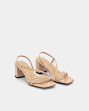 Pair of nude block heel sandals with straps