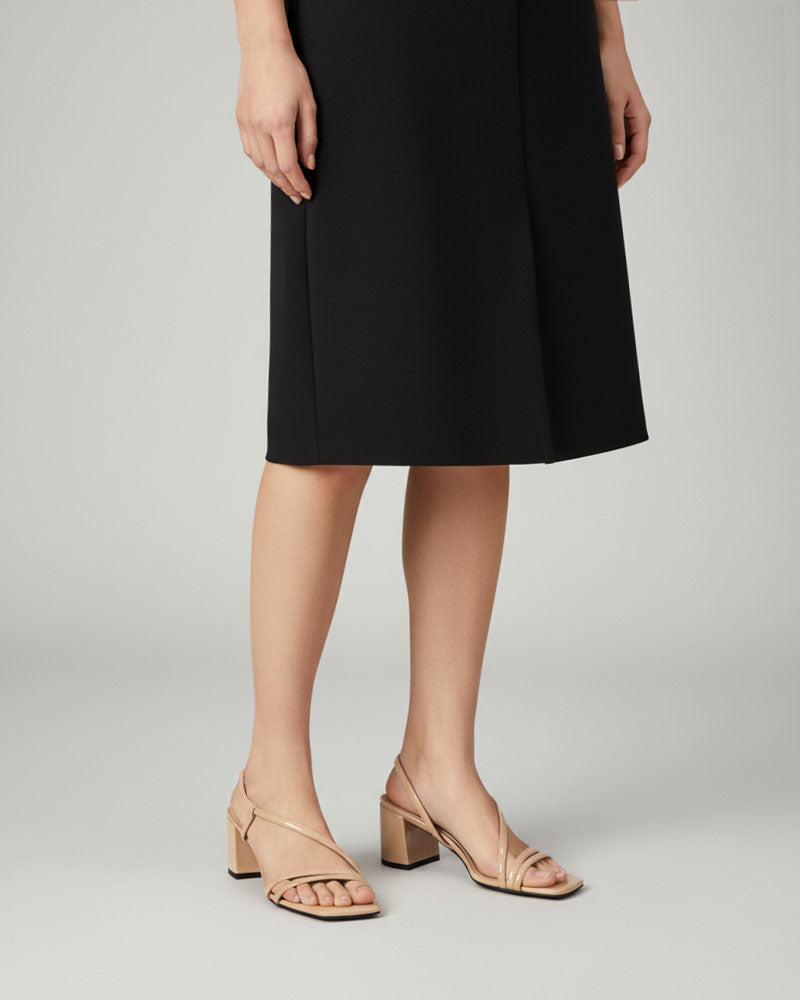 Model wearing nude strappy sandals with comfort block heel Australia