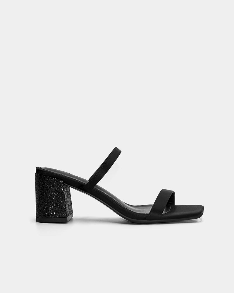 Black block heel sandals with glitter accents for elevating evening outfits