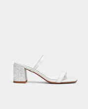 Side view of white sandals with block heel