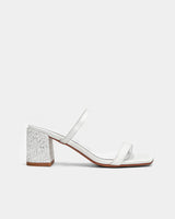 Side view of white sandals with block heel