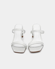 White heeled sandals with leather straps and padded footbed