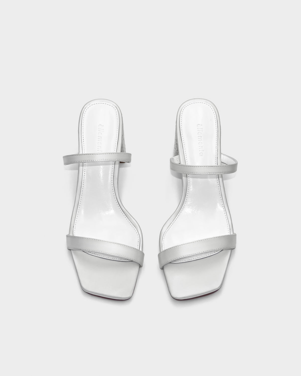 Women's white sandals with cushioned leather footbed for comfort