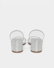 Pair of white sandals with glitter block heel and adjustable straps