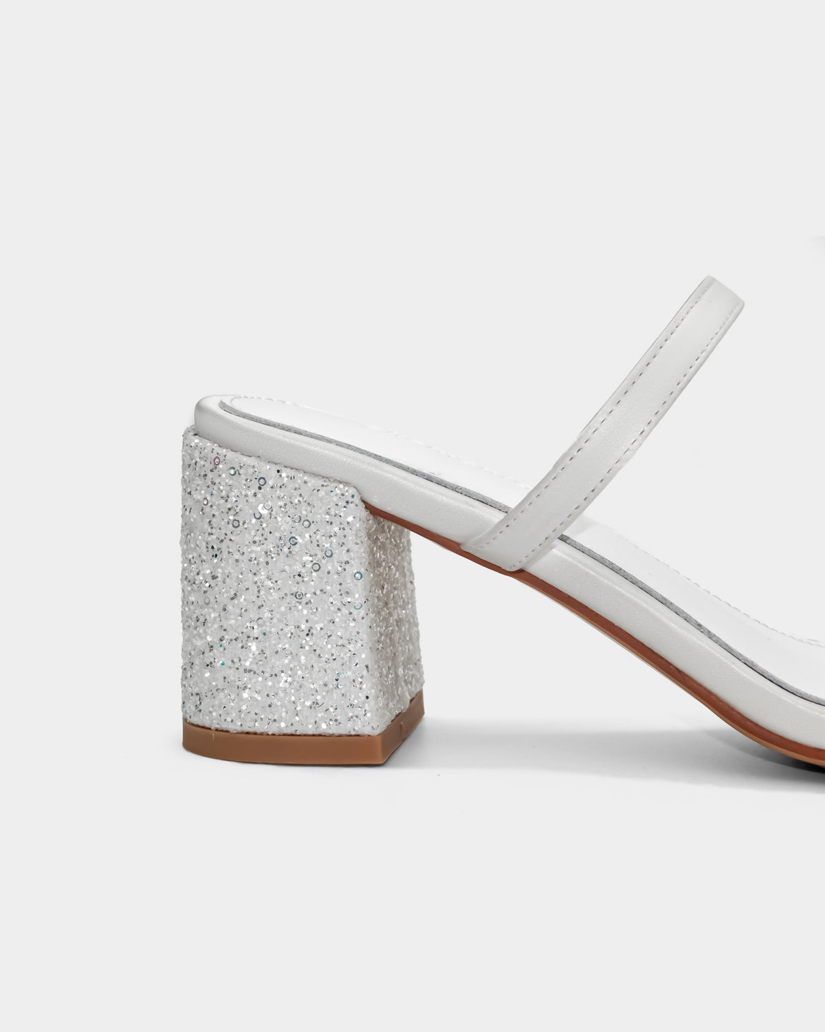 Women's white sandal with a glittery block heel stable and comfort