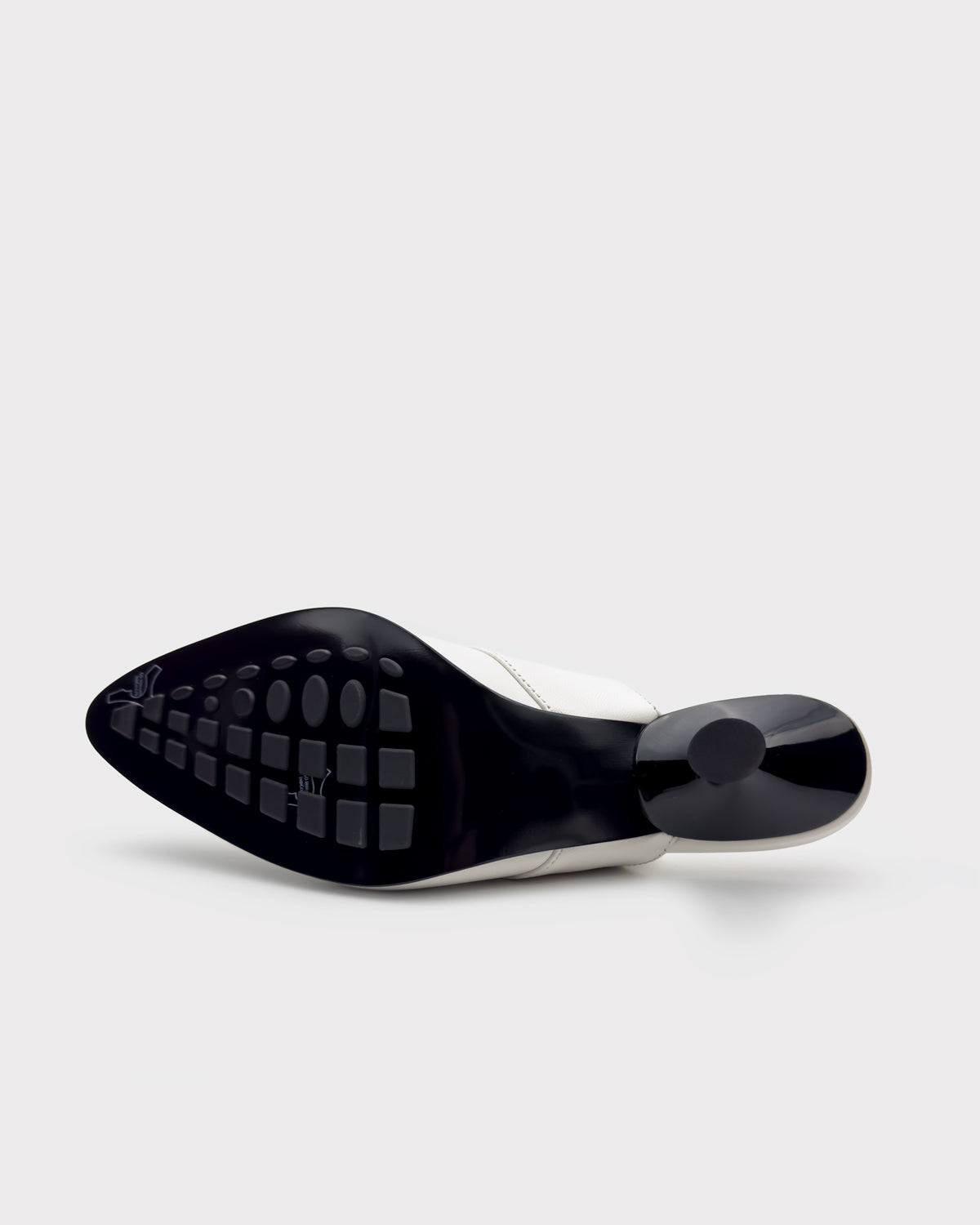 rubber injected leather sole of white mules 