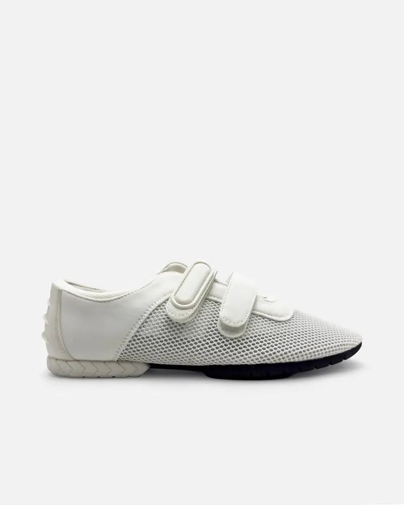 Side view of white sneaker with double straps