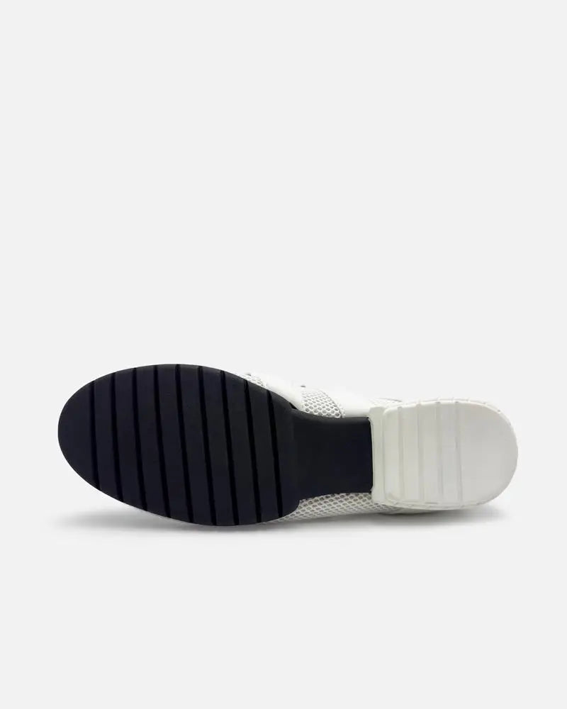 Flexible rubber sole of white sneakers