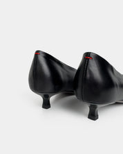 black kitten heel counter details on light gray background 