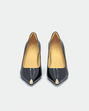 stylish black heeled shoes in glossy patent leather as evening shoes 