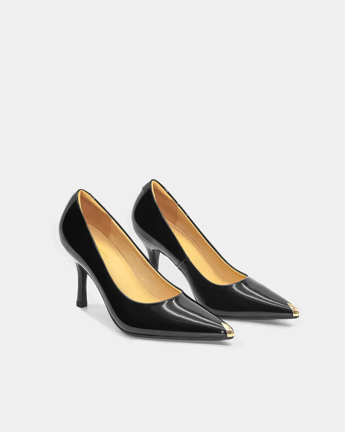 The perfect black heeled shoes in patent black leather for work and play