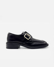 Women's black leather loafer with buckle strap