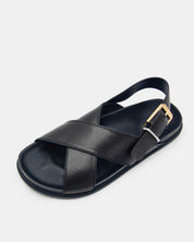 Black sandal with cross straps in leather