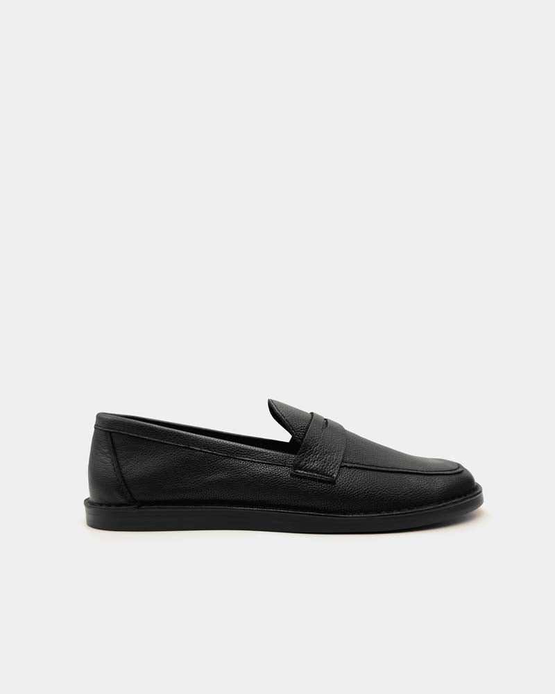 Side view of black penny loafers in leather