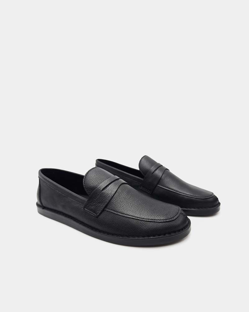 Pair of black leather penny loafers