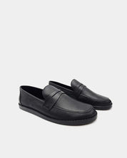 Pair of black leather penny loafers