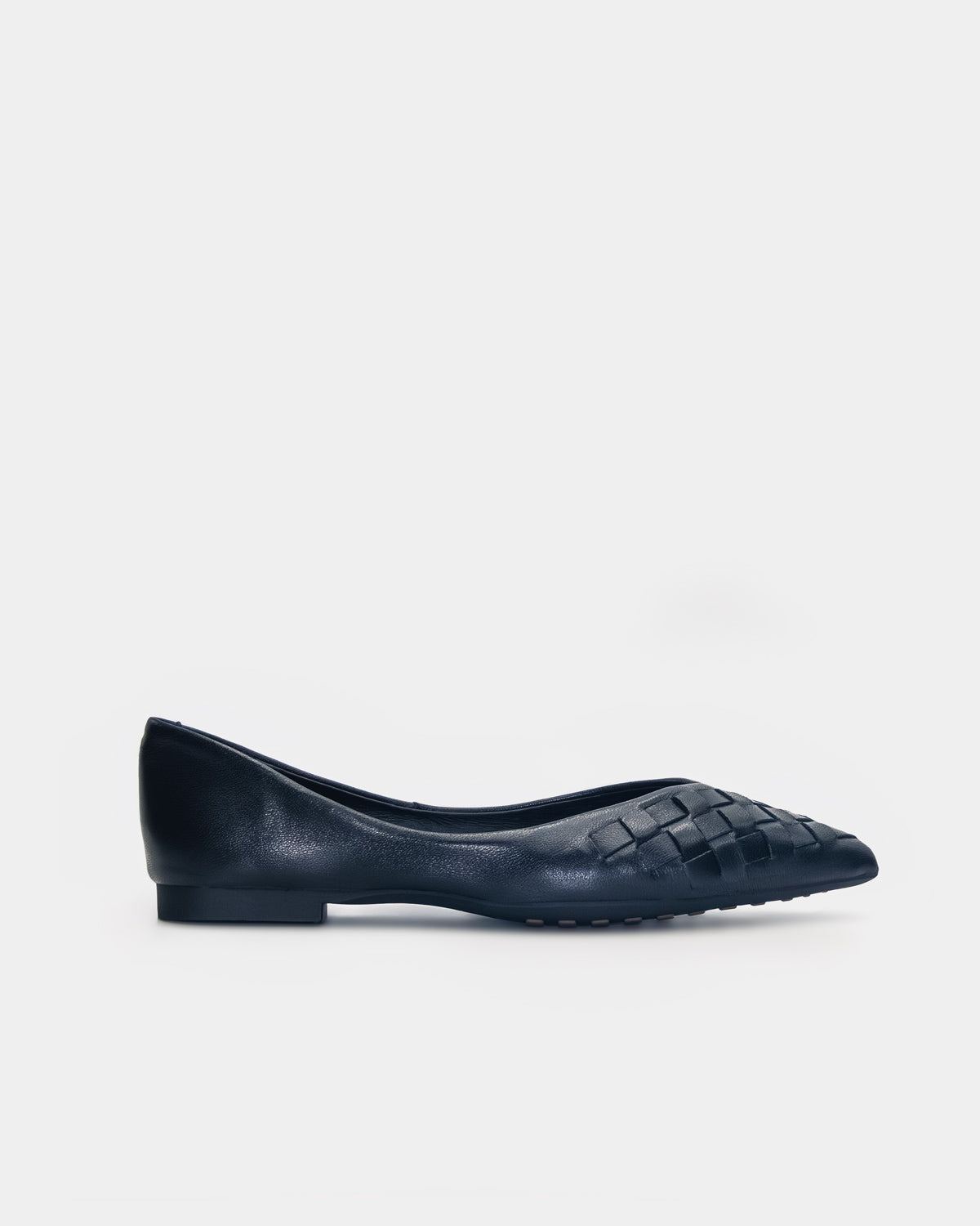 A single black leather flat shoe with a woven pattern on the toe, shown in profile against a light gray background.