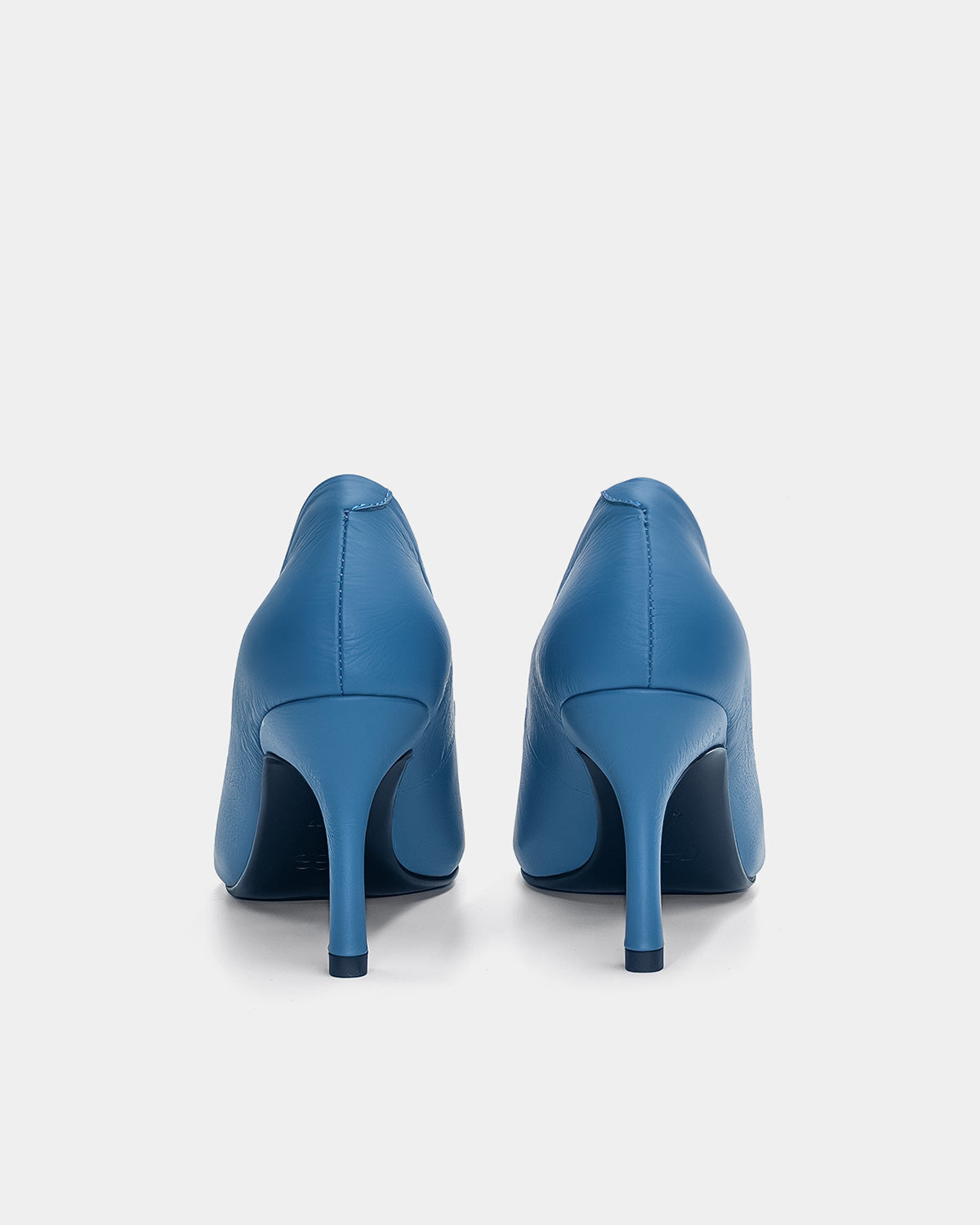 back view of blue heeled pumps with mid heels