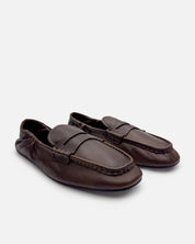 Dark brown leather loafers for women with sleek line design and flexible sole.