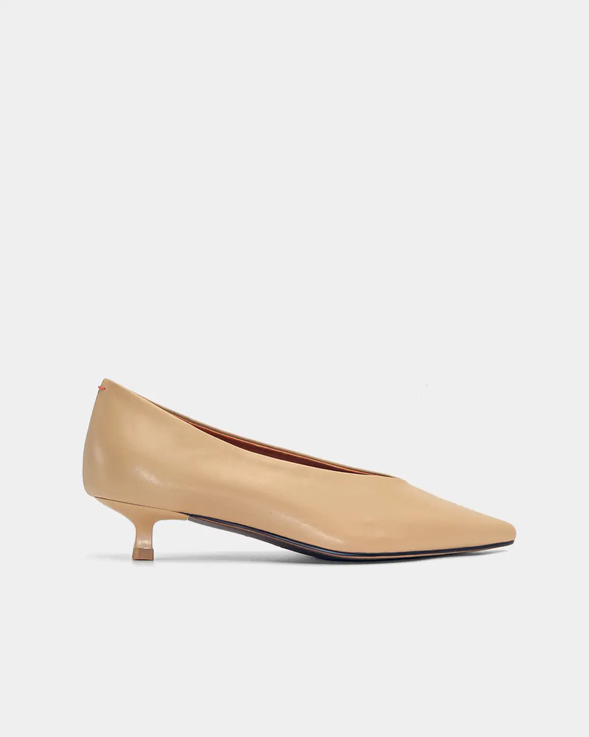 Sophisticated tan kitten heels crafted from premium calfskin leather with a delicate pointy toe design