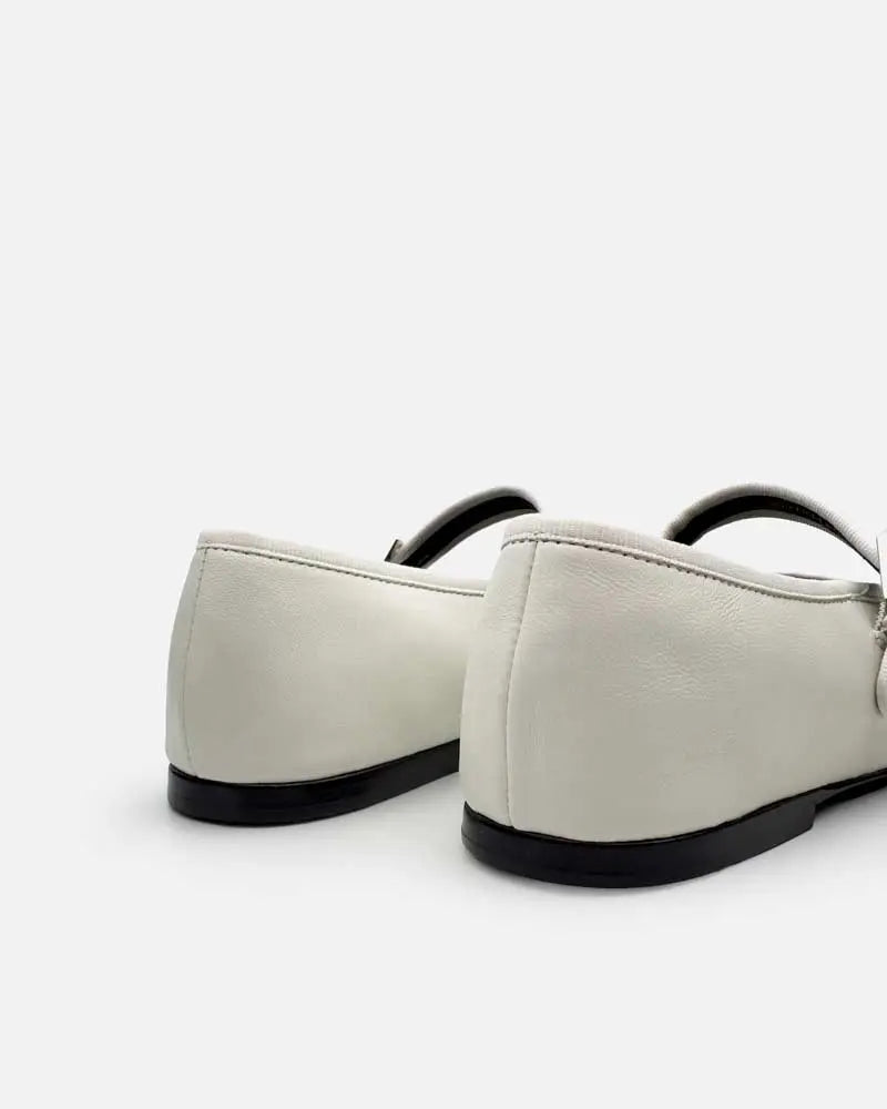 back view of white ballet flats in leather