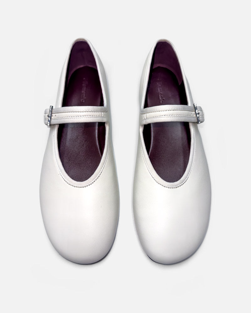 white ballet flats with cushioned leather footbed for all-day comfort