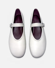 white ballet flats with cushioned leather footbed for all-day comfort
