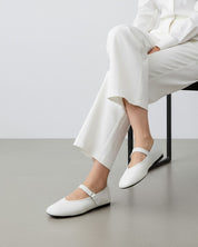 woman wearing white nappa leather ballet flats with V-cut vamp