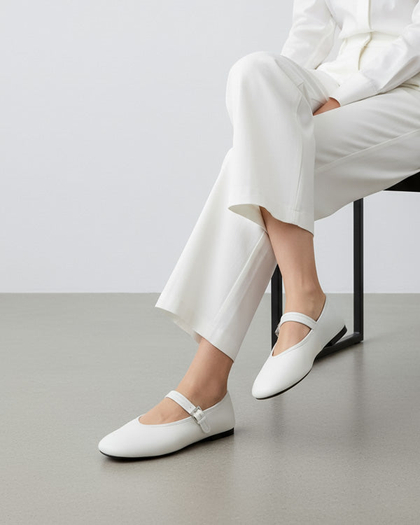 woman wearing white nappa leather ballet flats with V-cut vamp