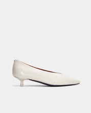 Side view of white leather kitten heels