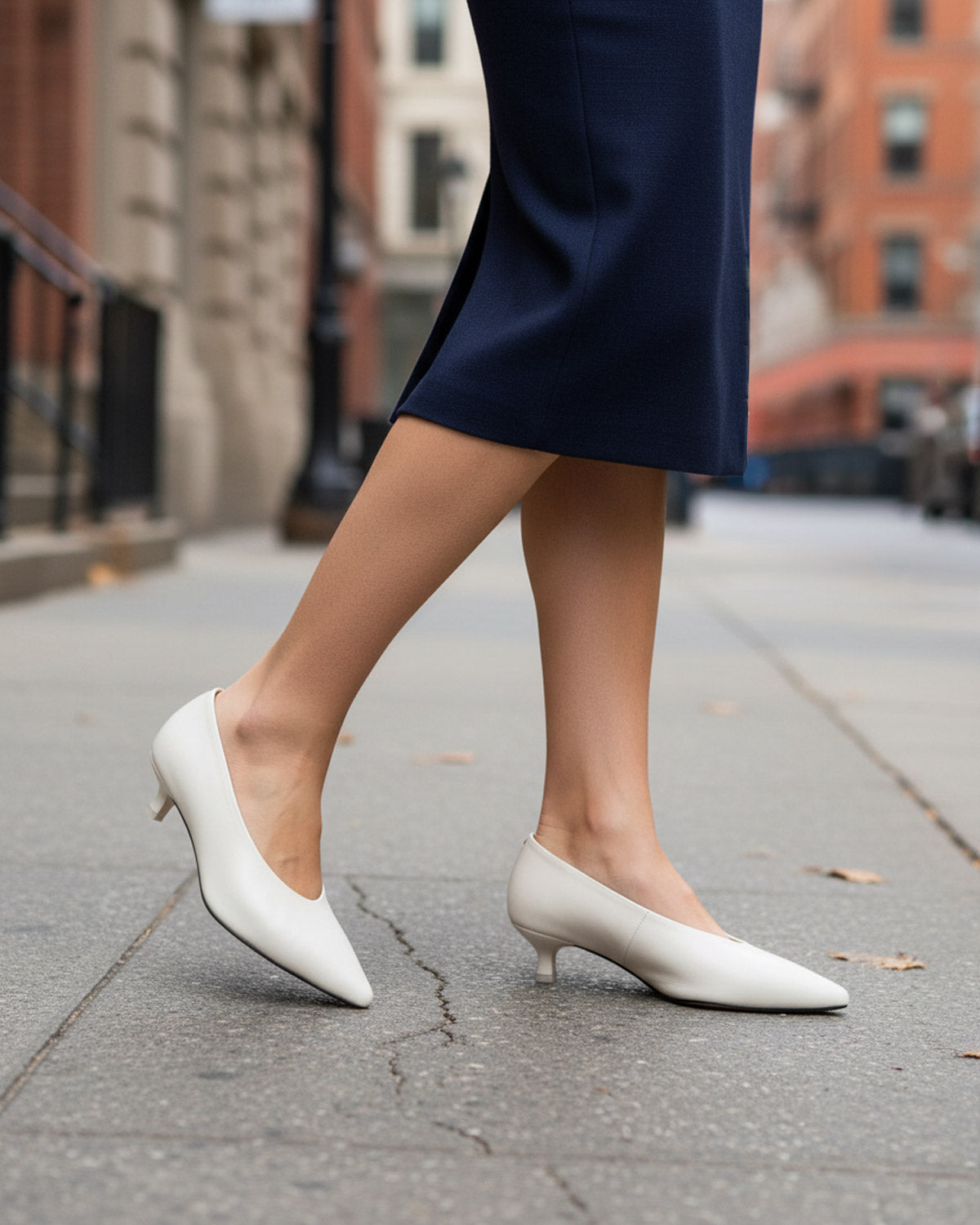 Woman wearing white leather kitten heels in Australia