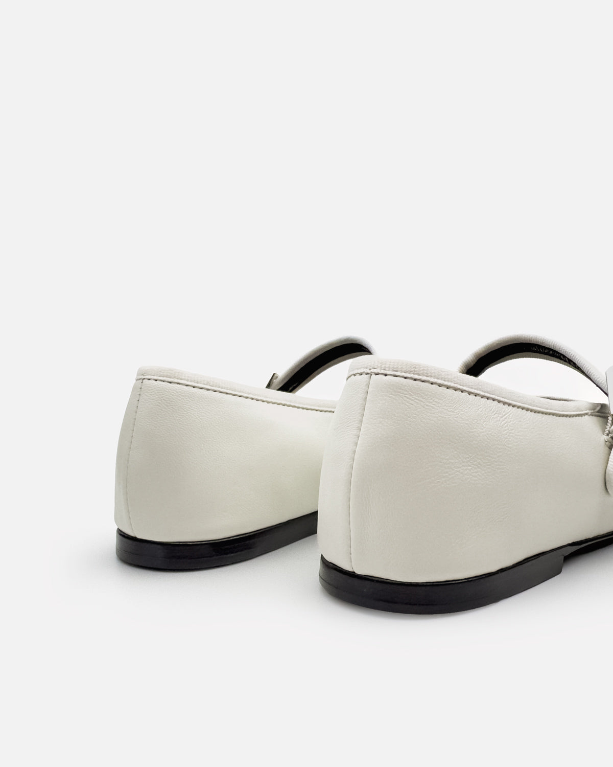 White leather ballet flats with flexible leather outsole