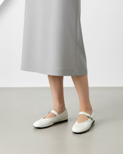 Ladies white leather ballet flats styled for office commute 